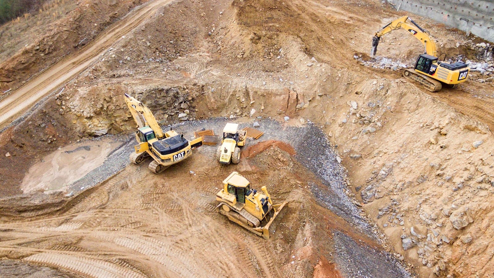 Excavators and earthmoving equipment at a McShane Construction jobsite
