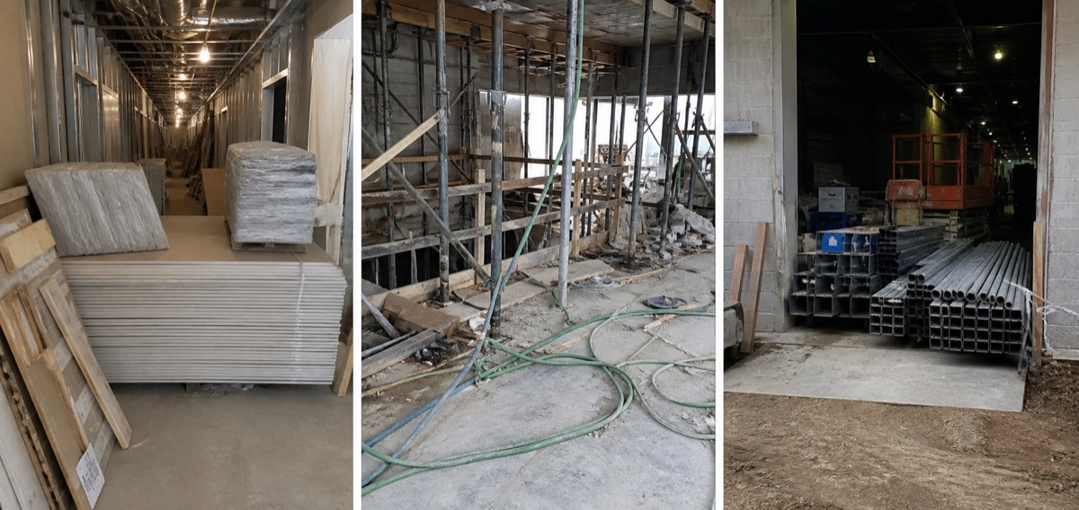 Drywall and pallets block an unfinished corridor